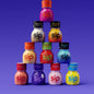 SIP Elixir bottles stacked in a pyramid including Sunset Punch, Xpresso, Citrus Spark, Tropical Crush, Watermelon, Blue Razz, Hurricane, Dreamberry, Wild Berry and Electric Lemon