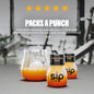 Two bottles of Citrus Spark energy drink with a glass of orange juice on a blurred background.