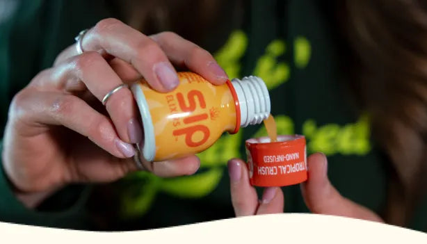 Person pouring liquid from a 'sip' bottle into a small container.